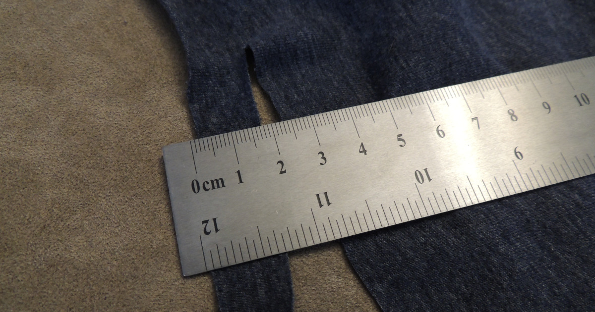 Ruler shows cutting width of t-shirt strip as 1.5 cm or .74 inches