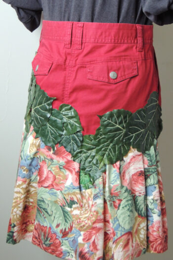 skirt made from red jeans and floral flounce with leafy garland, back view showing rear pockets with flaps