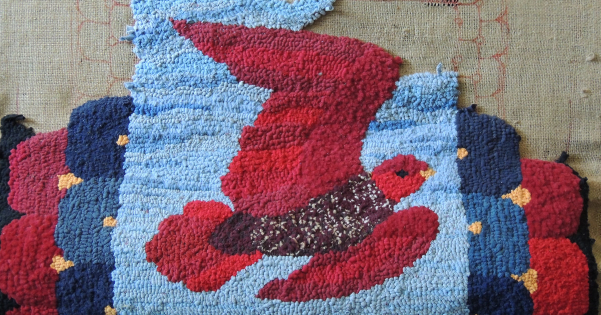 Partially completed rug made of t-shirt yarn strips